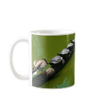 Four Turtles Trying to Cross a Log with Duck Block Coffee Mug