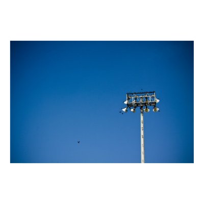 football field at night. Lights from a football field