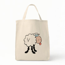 funny cute sheep sticking tongue out from behind canvas bag