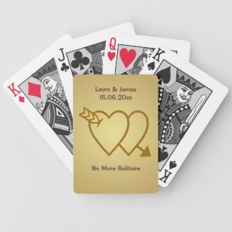 A deck of cards with a wedding theme that features the outline of two hearts pierced by an arrow on a golden background. The gift will appeal to card playing couples as the phrase below reads "No more solitaire", a pun alluding to the opportunity to play card games for two (or more).

