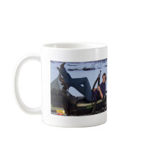 Gal Lying on a Snowmobile with Gun Mug