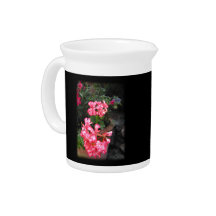Geraniums. Pelargonium flowers. Drink Pitchers