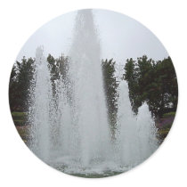 Geyser fountain surrounded by flowers round sticker