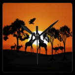 Giraffe at sunset wall clocks