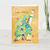 Giraffe nibbling on Christmas Tree Greeting Cards