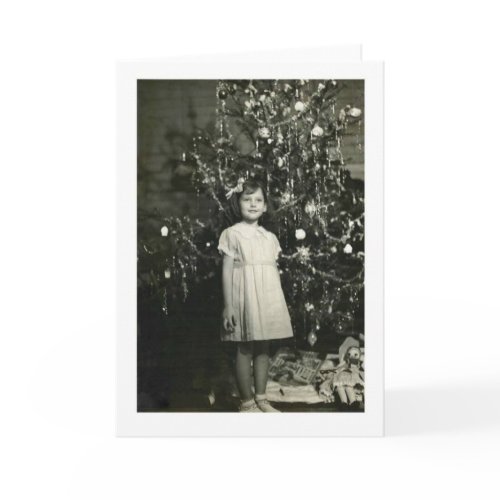 GIRL BY A CHRISTMAS TREE CARD card