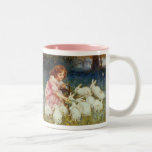 Girl feeding Rabbits Mug
