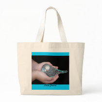 Girl holding baby budgie bag