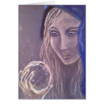 Girl in blue holding a crystal ball card