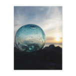 Glass float and sunset postcards