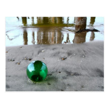 Glass float under pier postcards