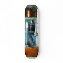 Glass Funnels and Barber Pole Skateboard