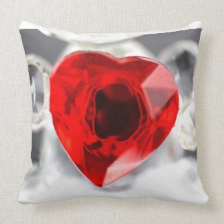 Glass love heart on a pillow