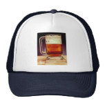 Glass mug filled with dark beer mesh hats