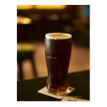 Glass of Irish ale in pub Post Cards