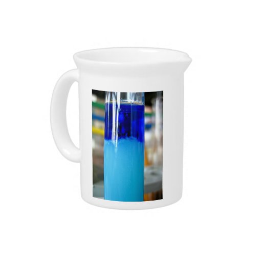 Glass vessels with solutions in different density drink pitchers