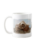 Goat skull on bamboo matt against blue back mugs