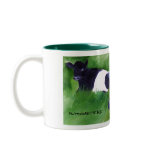 The pair of Dutch Belted cows gracing this mug are taking a break in the tall grass. Going Dutch Mug