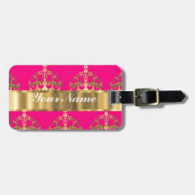 Gold crowns on hot pink luggage tags