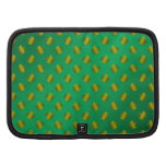 Gold shamrocks on green planners