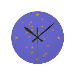 Gold stars on pale blue sky. round wallclocks