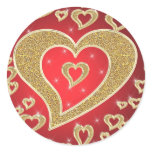 golden hearts on red background round stickers
