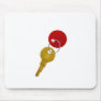golden key with red tag mouse pads