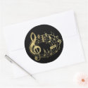 Golden musical notes in oval shape round sticker