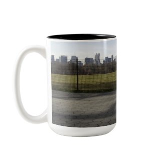 Golden Retriever dog on Great Lawn in Central Park in New York City NYC with skyline background coffee mug