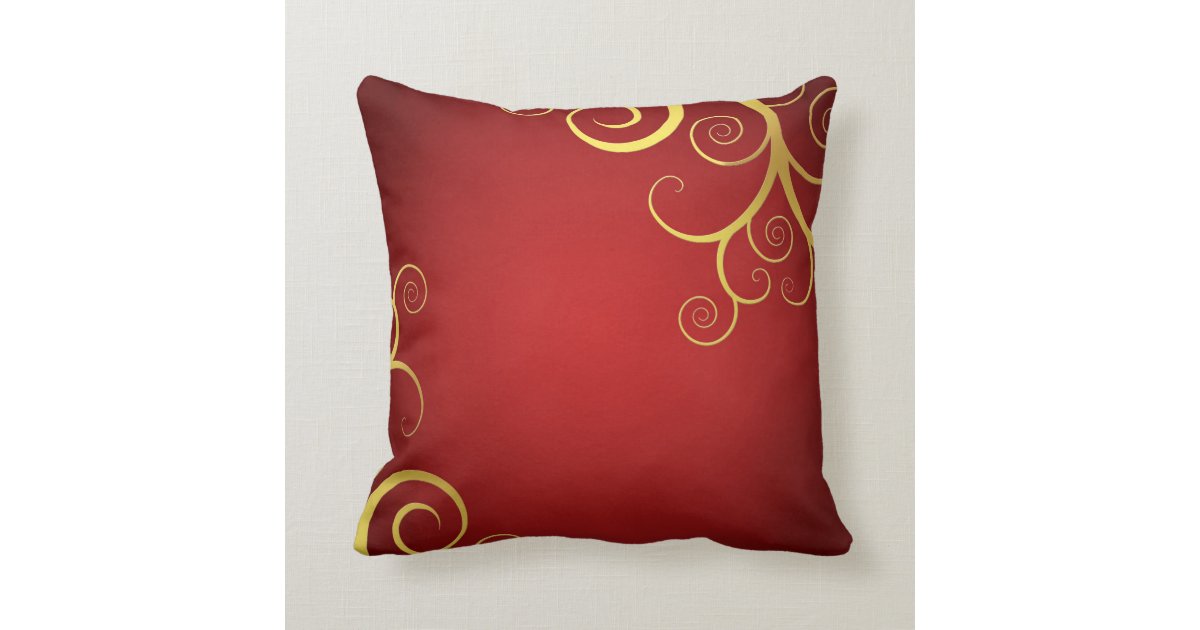 Golden swirls on deep red pillow Zazzle