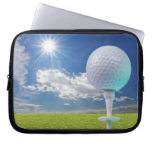 golf ball on a tee with grass computer sleeve