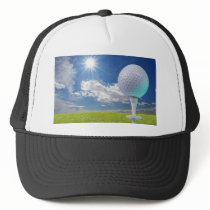 golf ball on a tee with grass hat