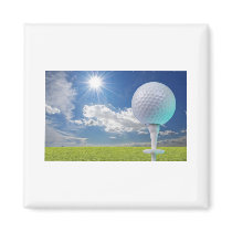 golf ball on a tee with grass magnets