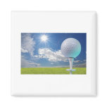 golf ball on a tee with grass magnets