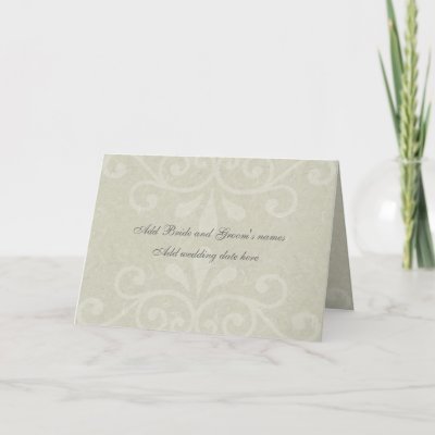  light gray scrolls adorn the front of this elegant wedding invitation