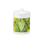 Green foliage and flowers tea pot