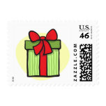 Green gift with red ribbon postage stamp
