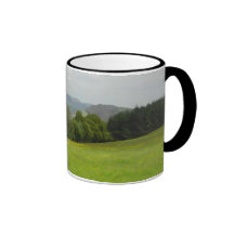 Green meadow. Countryside scenery. Coffee Mugs