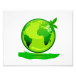 green yellow globe over grass reflective earth des art photo