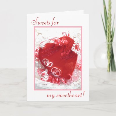 Valentine greeting card in red, pink and white, with a heart-shaped box of 