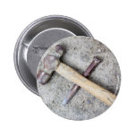 Grungy hammer and chisel button