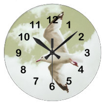 gull flying by the sea wall clock