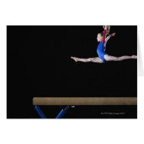 Gymnast (9-10) leaping on balance beam 2 cards