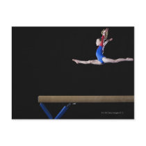 Gymnast (9-10) leaping on balance beam 2 post cards