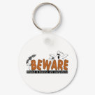 round_keychain - Halloween Beware T-shirts, sweatshirts, bodysuits, mugs, cards, stickers, trick or treat tote bags, and other Halloween clothing and gifts with a ghost and bat design that warns to beware the ghosts and goblins that are everywhere!: Sizes 