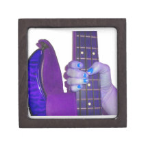 Hand holding bass guitar blue and purple photo premium gift box