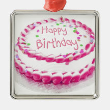 Happy birthday cake with pink frosting christmas tree ornaments