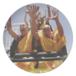 Happy buddhist monks on a roller coaster dinner plates