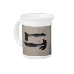 Hatchet and hammer in display drink pitcher