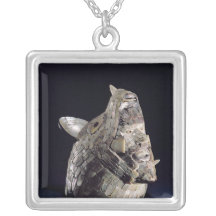 Head of an animal with human head in open jaws jewelry